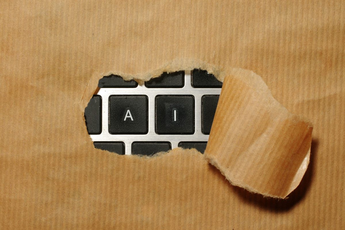 AI-for-Efficiency_-How-to-Automate-Daily-Tasks-and-Free-Up-Your-Time-Without-a-Huge-Budget-scaled.jpg A piece of cardboard with a keyboard appearing through it
