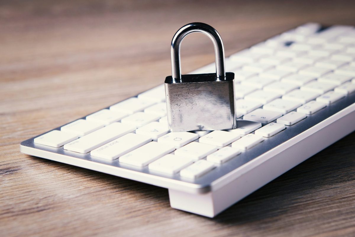 Remote-Work-Security-Revisited_-Advanced-Strategies-for-Protecting-Your-Business-in-2025-scaled.jpg a computer keyboard with a padlock on top of it